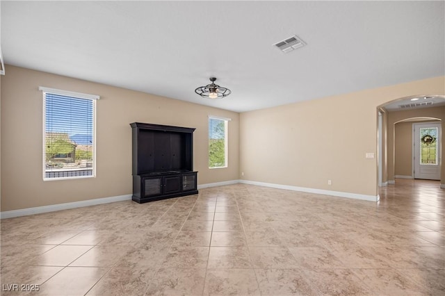 unfurnished living room with light tile patterned floors