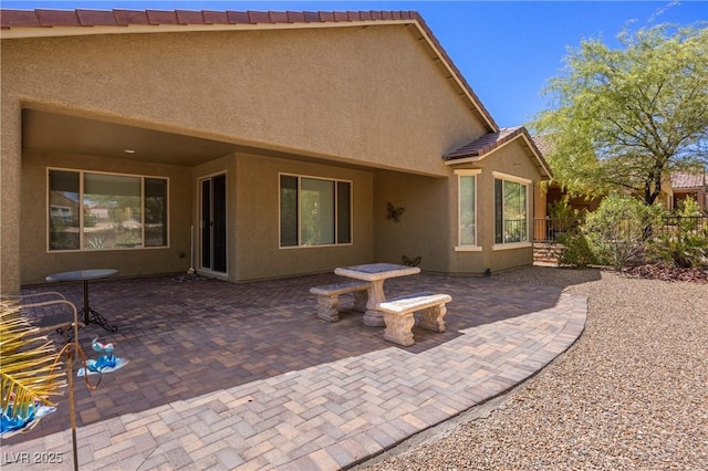 rear view of house featuring a patio area