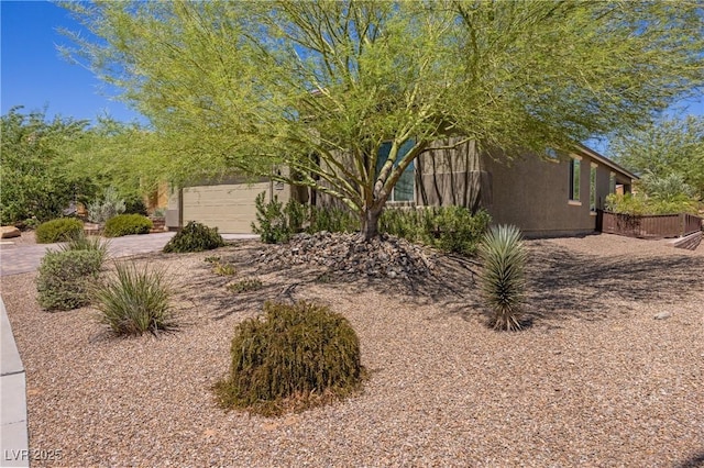 view of yard featuring a garage