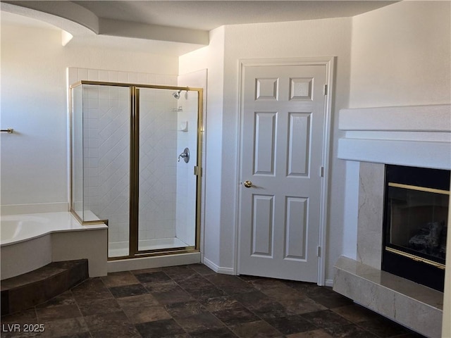 bathroom featuring separate shower and tub