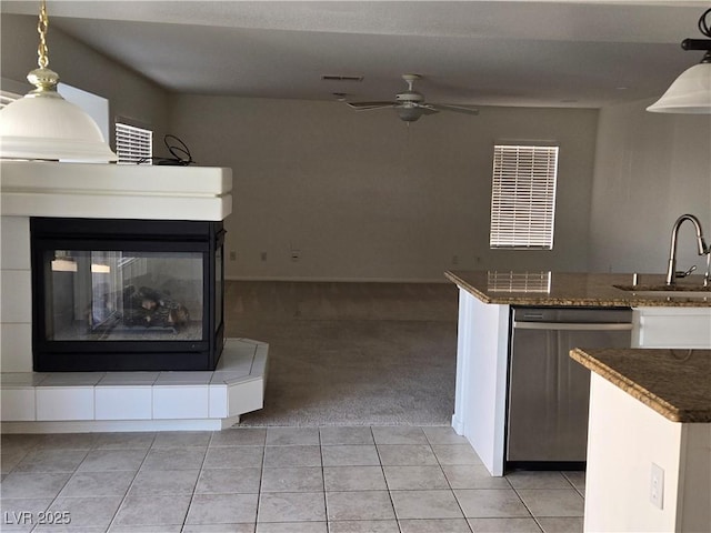 kitchen featuring light carpet, ceiling fan, dishwasher, white cabinets, and sink