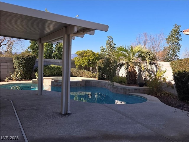 view of pool with a patio and an in ground hot tub