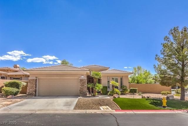 prairie-style home with a garage and a front lawn