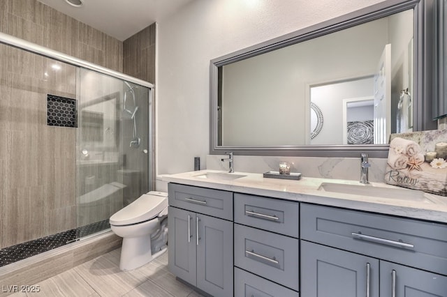 bathroom featuring toilet, vanity, and walk in shower