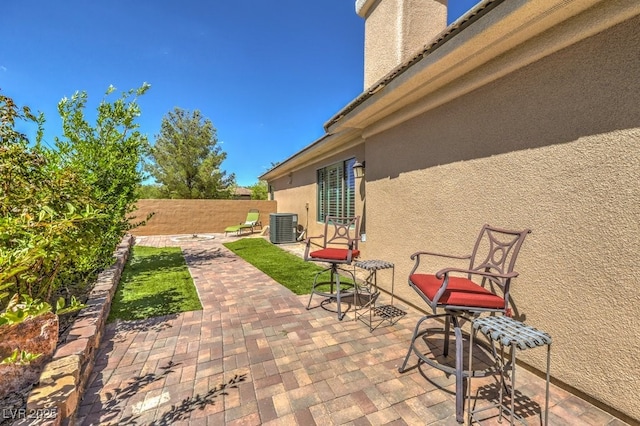 view of patio with central AC