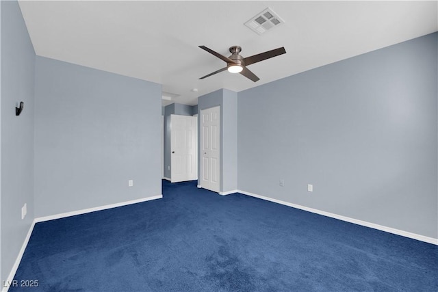 unfurnished bedroom featuring ceiling fan and dark colored carpet