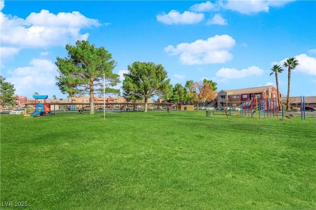 exterior space featuring a playground and a lawn