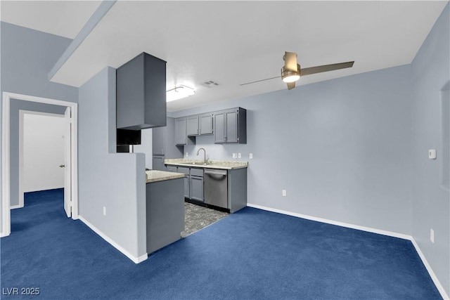 kitchen featuring dark carpet, stainless steel dishwasher, ceiling fan, sink, and gray cabinets