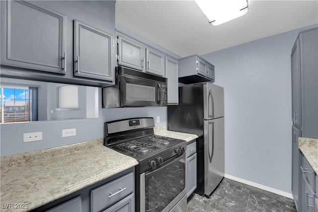 kitchen with gray cabinets and appliances with stainless steel finishes