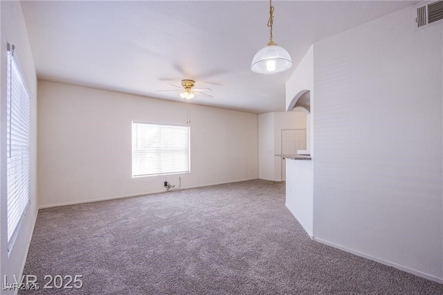 carpeted empty room with ceiling fan