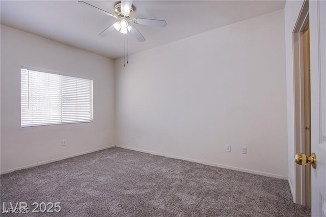 carpeted spare room with ceiling fan