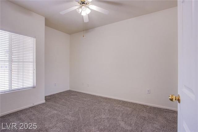 carpeted spare room with ceiling fan