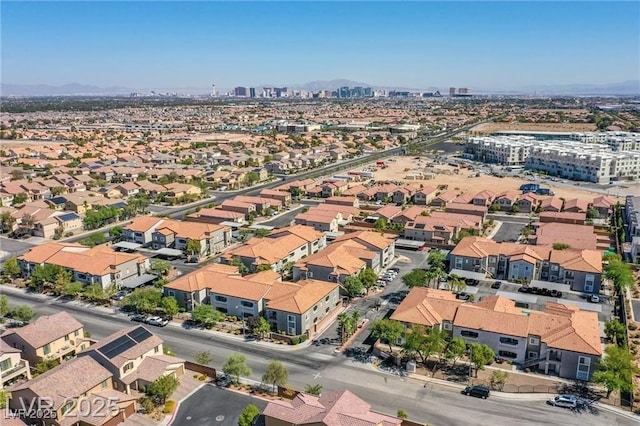 birds eye view of property with a mountain view