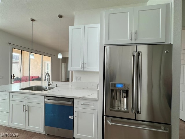 kitchen featuring white cabinetry, sink, and appliances with stainless steel finishes