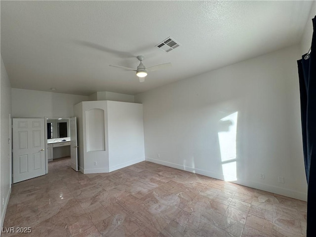 spare room with ceiling fan