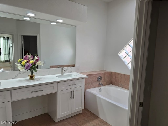 bathroom featuring a bathing tub and vanity