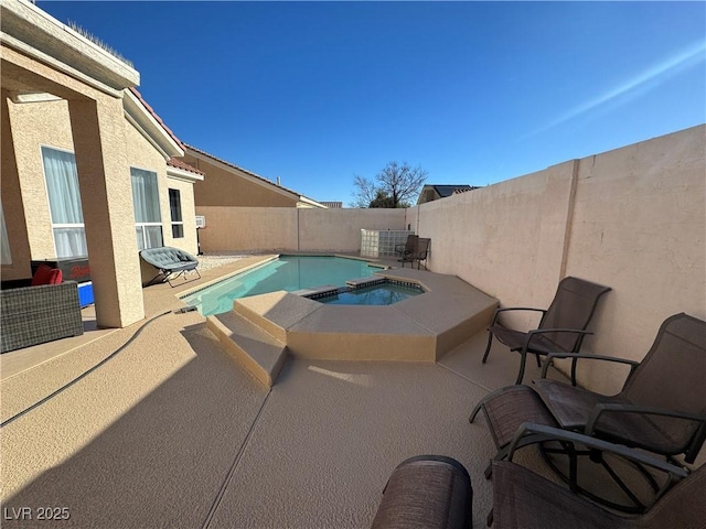 view of pool featuring an in ground hot tub and a patio