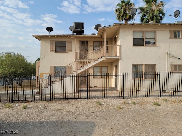 view of property with central AC unit