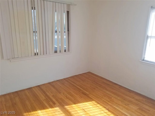 spare room with light hardwood / wood-style floors