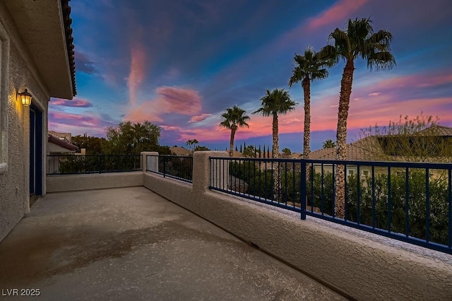 patio terrace at dusk with a balcony