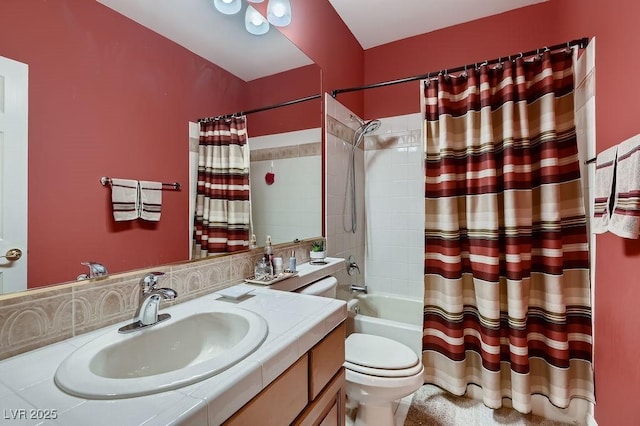 full bathroom featuring shower / tub combo with curtain, vanity, and toilet