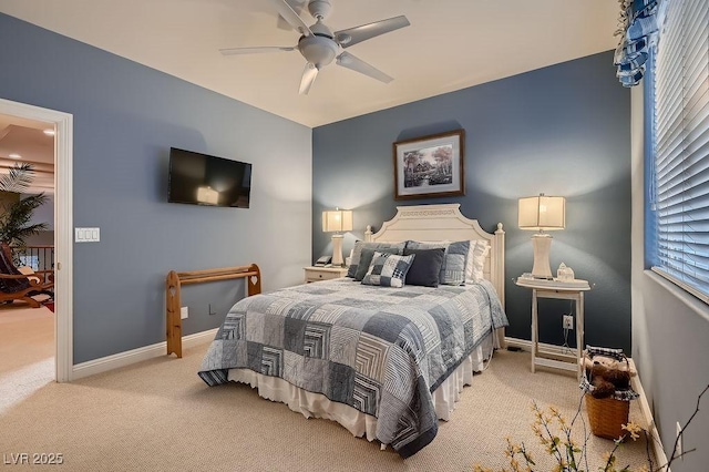 bedroom featuring light carpet and ceiling fan