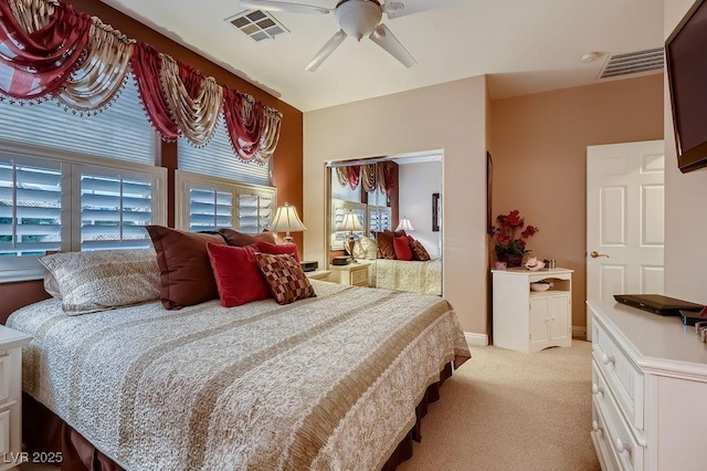 carpeted bedroom with ceiling fan