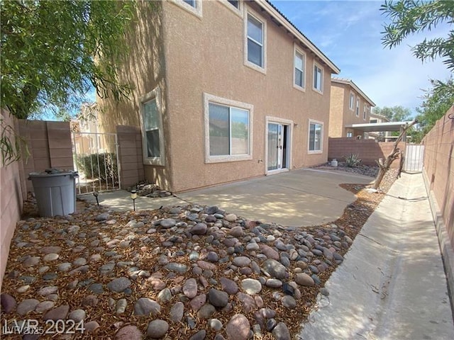 back of property featuring a patio area