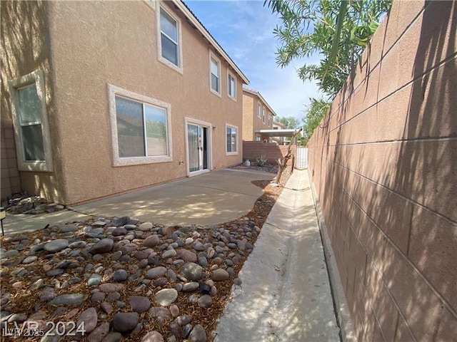 view of home's exterior with a patio area