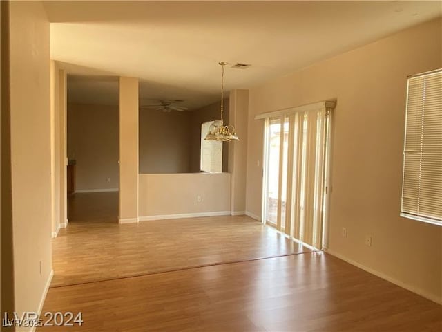 empty room featuring hardwood / wood-style floors and ceiling fan