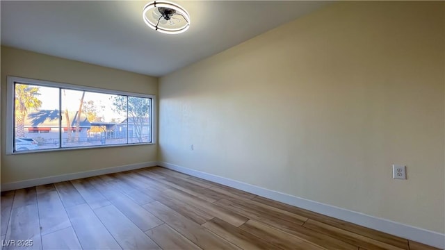 unfurnished room featuring light hardwood / wood-style floors