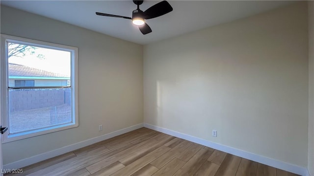 unfurnished room featuring ceiling fan and light hardwood / wood-style flooring