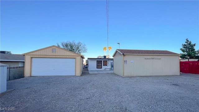 view of front facade with an outdoor structure and a garage