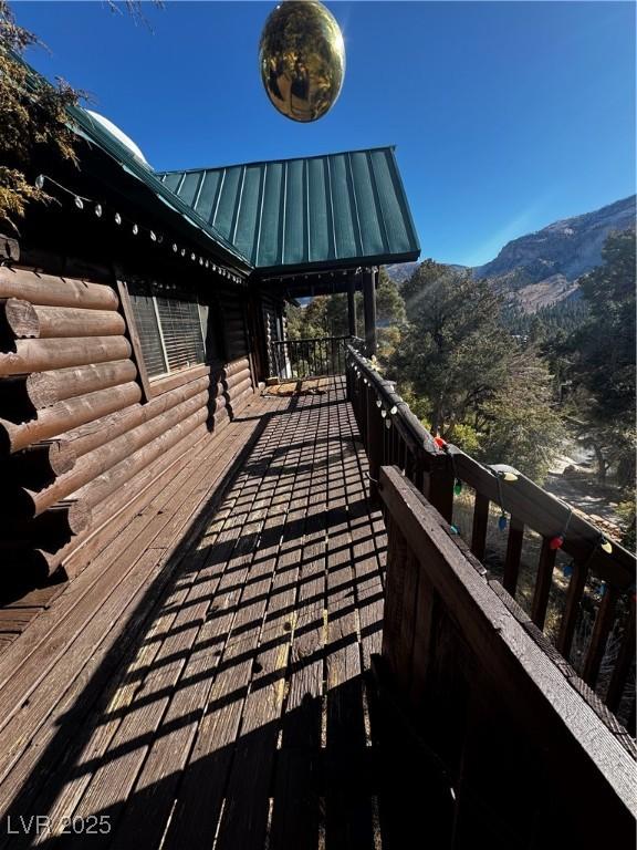 wooden terrace featuring a mountain view