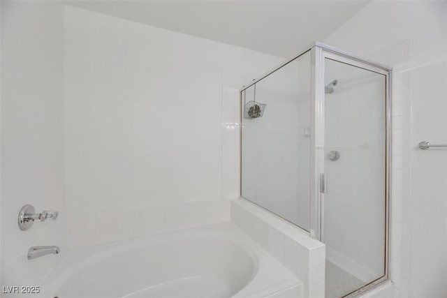 bathroom featuring plus walk in shower