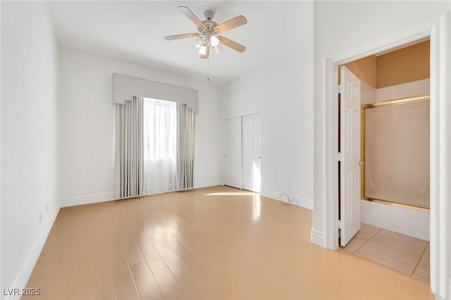 unfurnished bedroom with a closet and ceiling fan