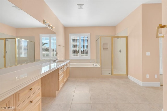 bathroom with tile patterned flooring, separate shower and tub, and vanity