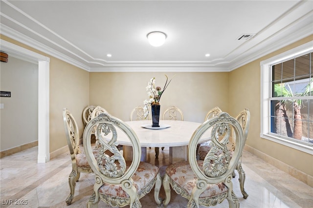 dining room featuring ornamental molding