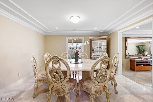 dining space with ornamental molding