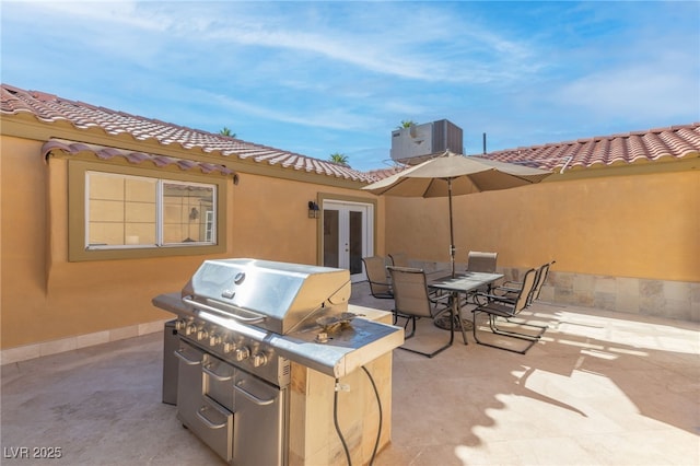 view of patio with french doors and cooling unit