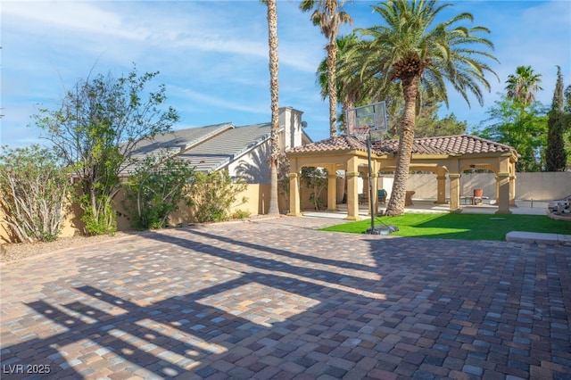 exterior space featuring a patio area and a front yard