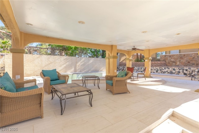 view of patio featuring outdoor lounge area and ceiling fan