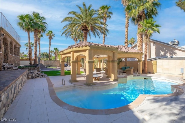 view of swimming pool featuring a gazebo and a patio