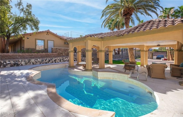 view of swimming pool with a patio area