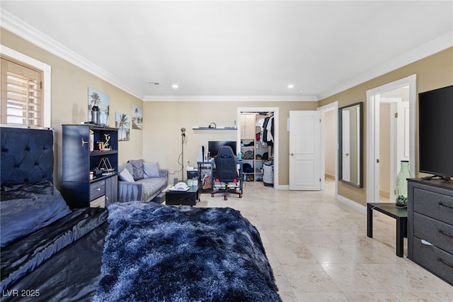 bedroom with a walk in closet and ornamental molding