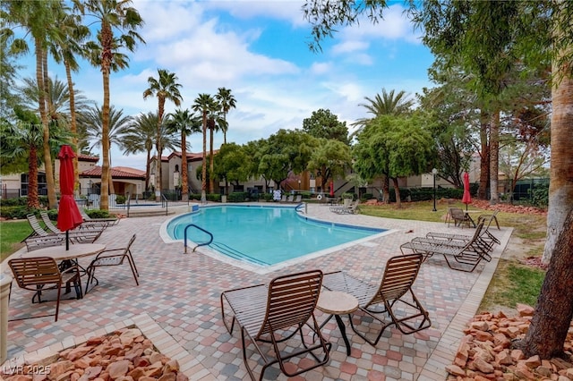 view of swimming pool featuring a patio