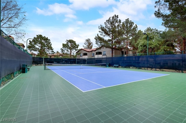 view of sport court with basketball hoop