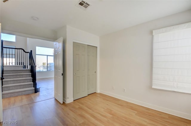 spare room featuring light hardwood / wood-style floors