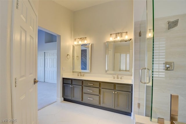 bathroom with tile patterned flooring, vanity, and a shower with shower door