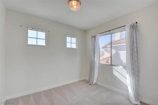 empty room with light colored carpet